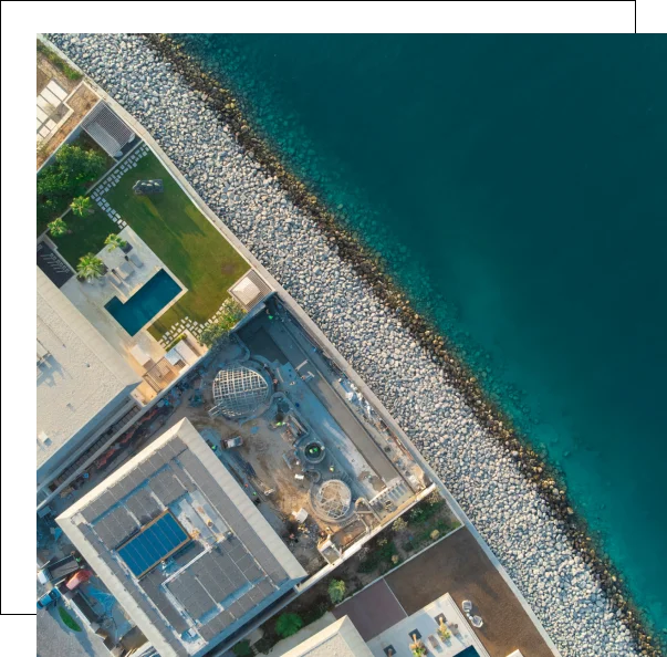 Building and stone structures by water.